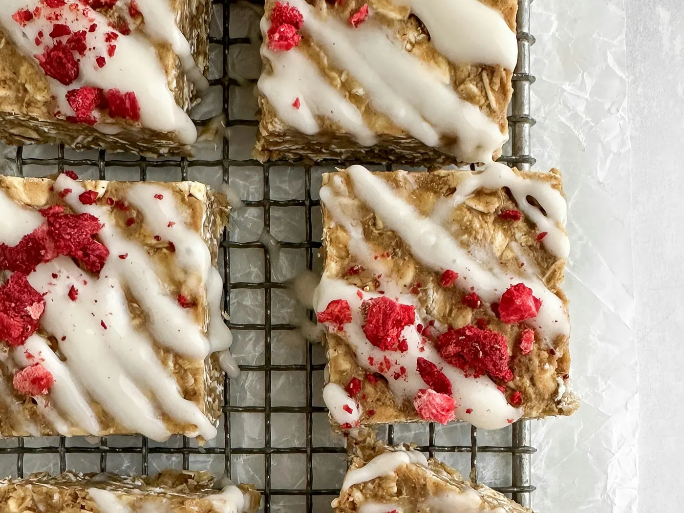 Glazed oat bars cooling on a wire rack